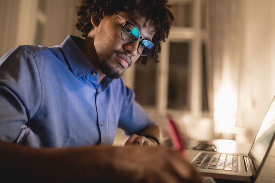 young man writing informative speech